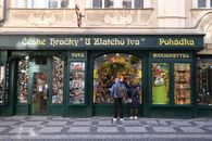 Explore a whimsical Prague toy shop showcasing traditional Czech marionettes and handcrafted toys.
