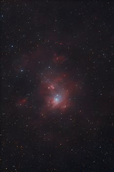 Capture of a bright cosmic nebula with vivid stars, showcasing the beauty of the universe.