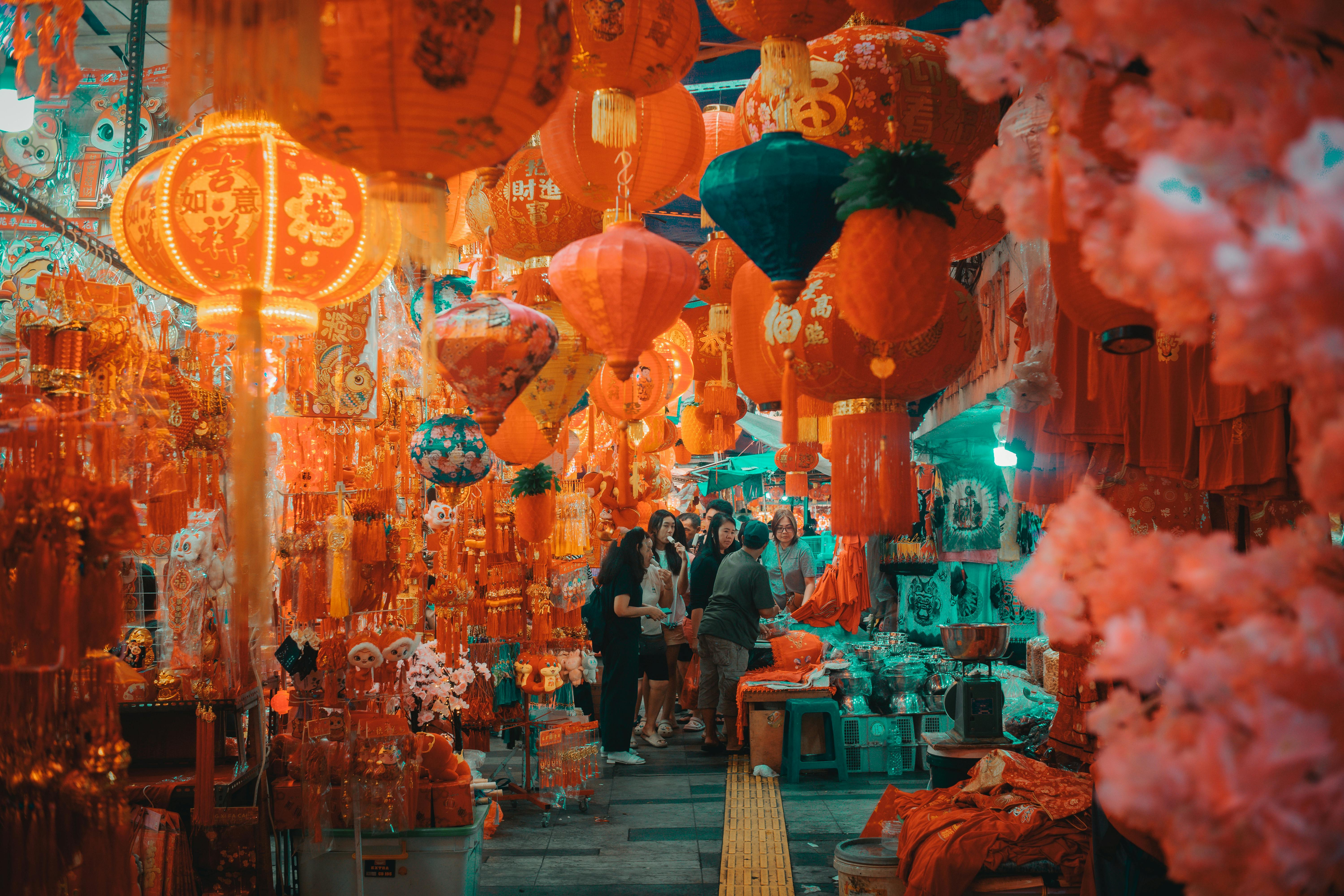 Chinatown street in Singapore decorated with red lanterns and golden ornaments during Chinese New Year celebrations