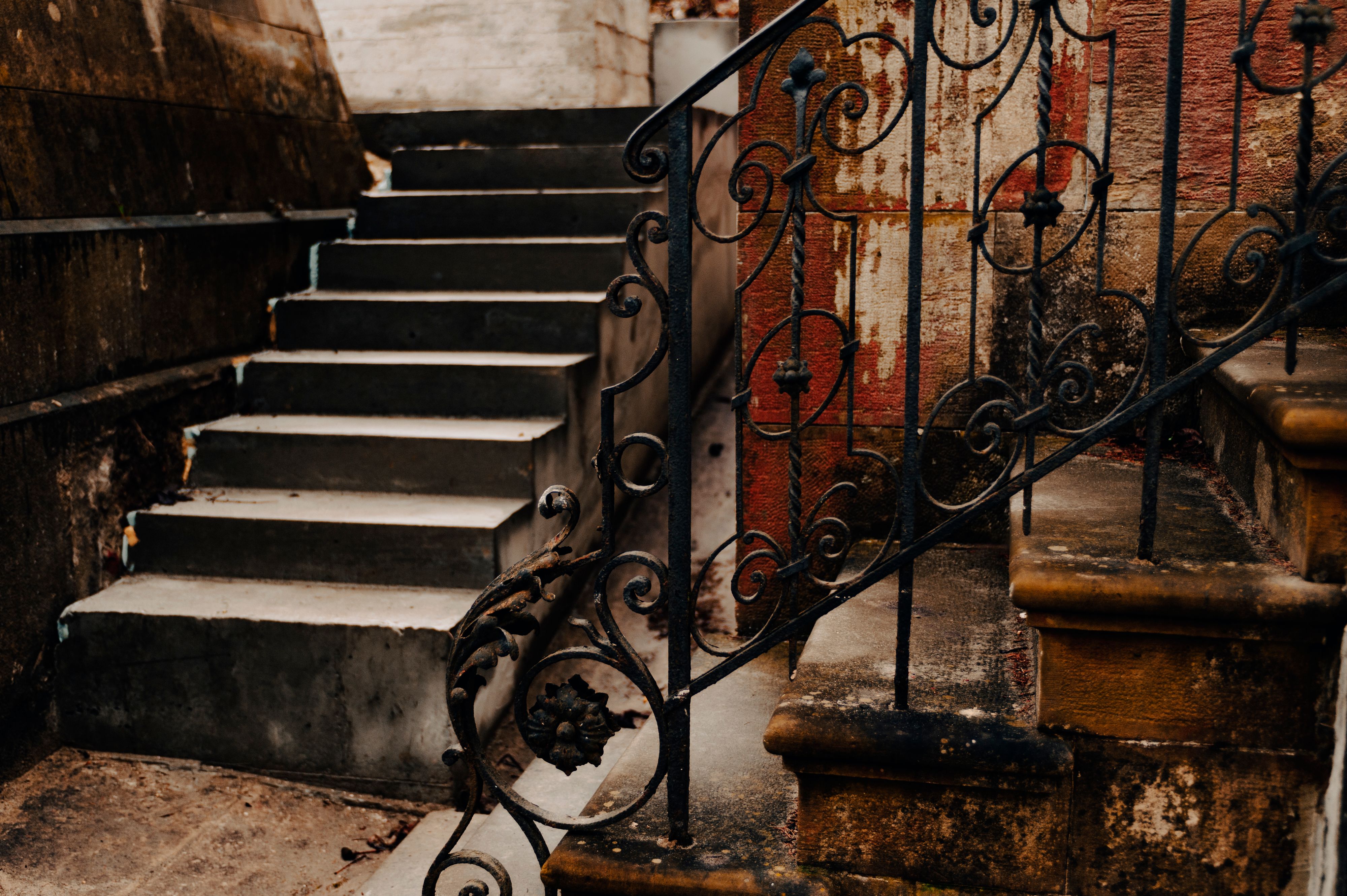 Stone steps climbing upward beside an old wall - Climbing the Staircase