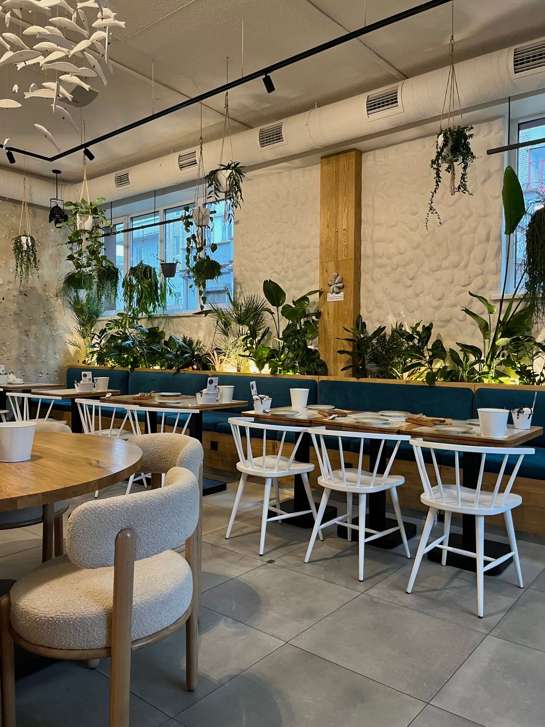 Modern Botanical Restaurant Interior with Greenery · Free Stock Photo