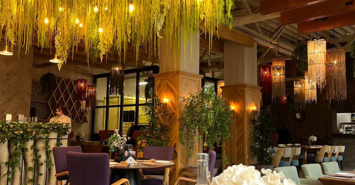 Elegant Restaurant Interior with Botanical Decor · Free Stock Photo