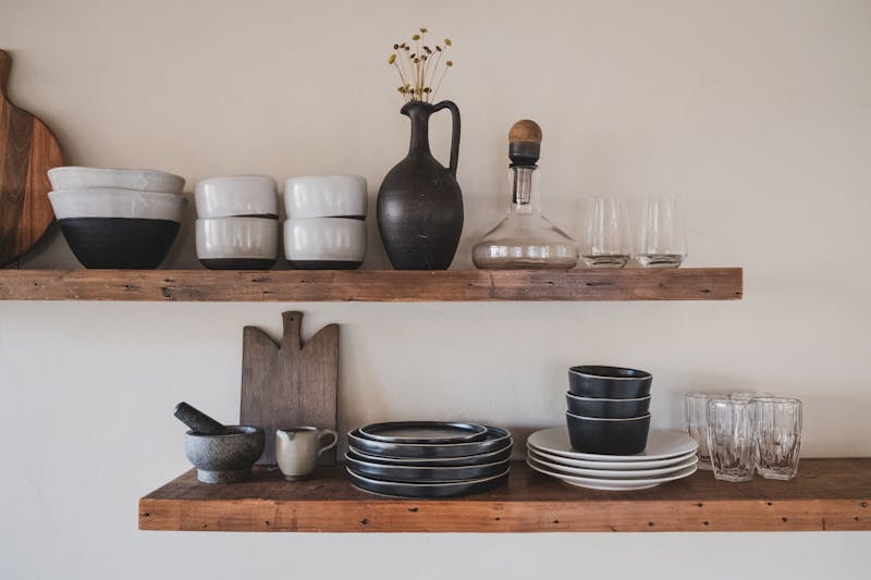 Ceramic bowls and pottery on studio shelves