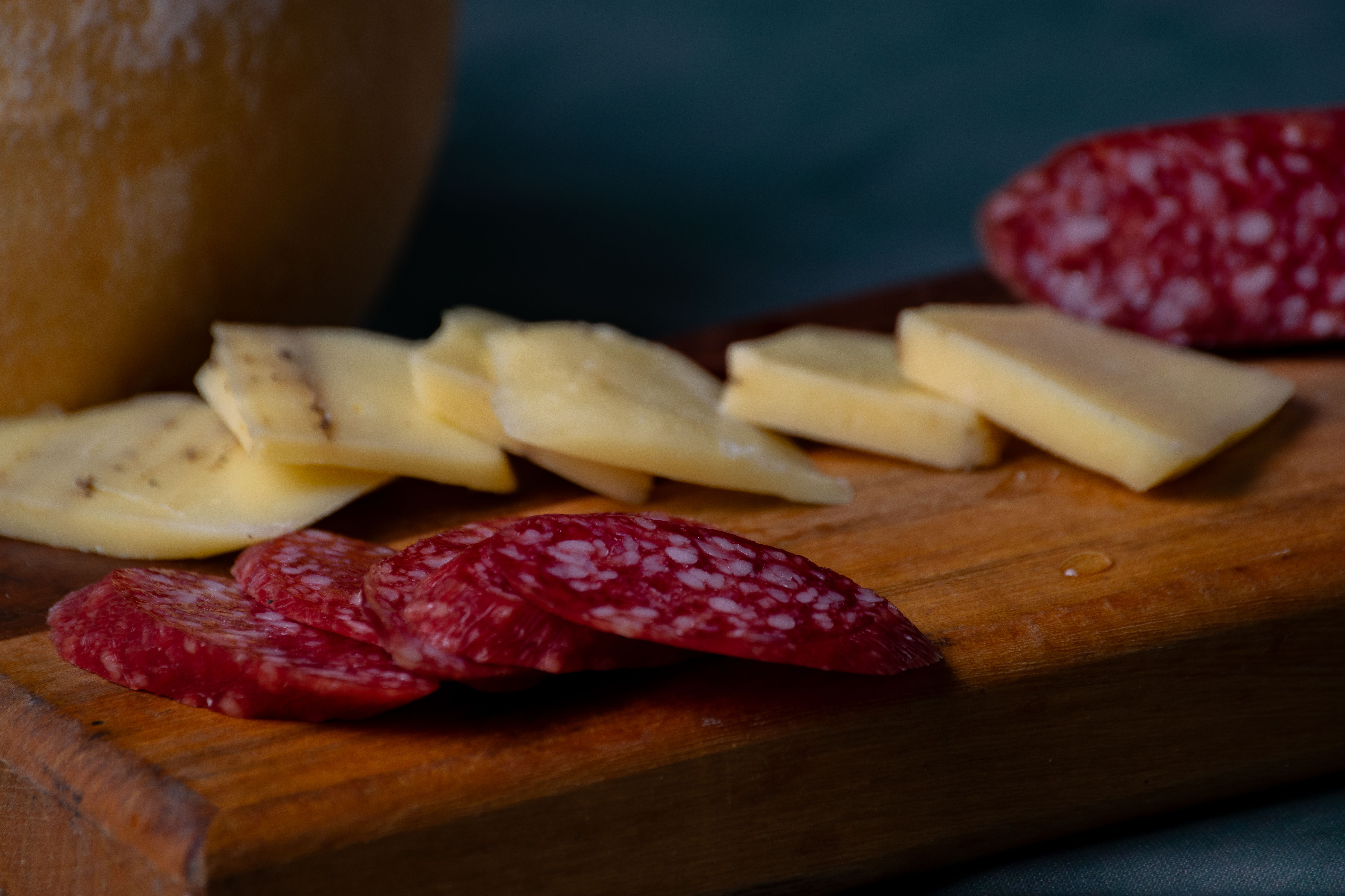 Rustic Cheese and Salami Platter Close-Up · Free Stock Photo