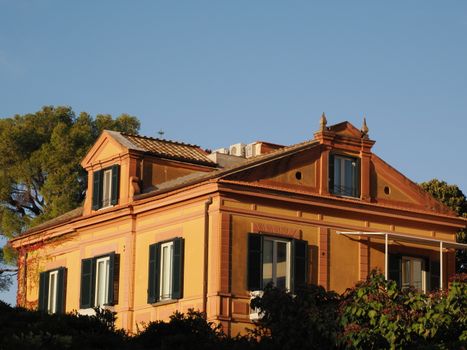 Charming Mediterranean villa in Positano, Italy features vibrant architecture under a clear sky.