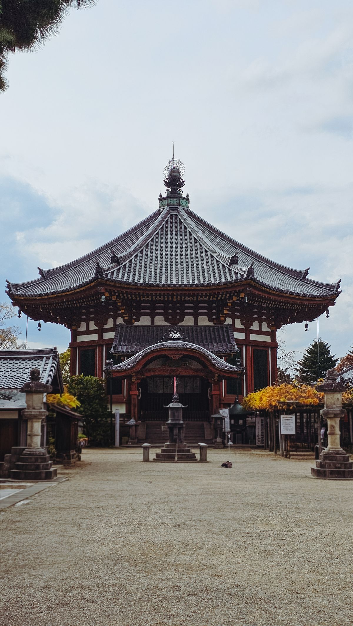 A traditional Japanese Buddhist temple hall with ornate wooden architecture