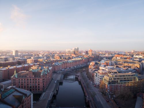 Free Explore the stunning aerial view of Hamburg's iconic Speicherstadt and Elbphilharmonie. Stock Photo