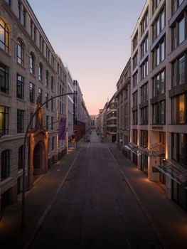A serene street view in Hamburg at sunrise, showcasing classic architecture.