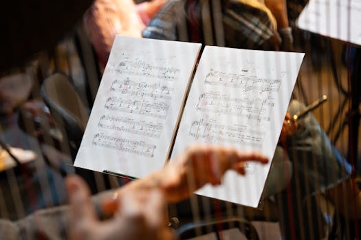 Musician's hands and sheet music focus, capturing a detailed musical scene.