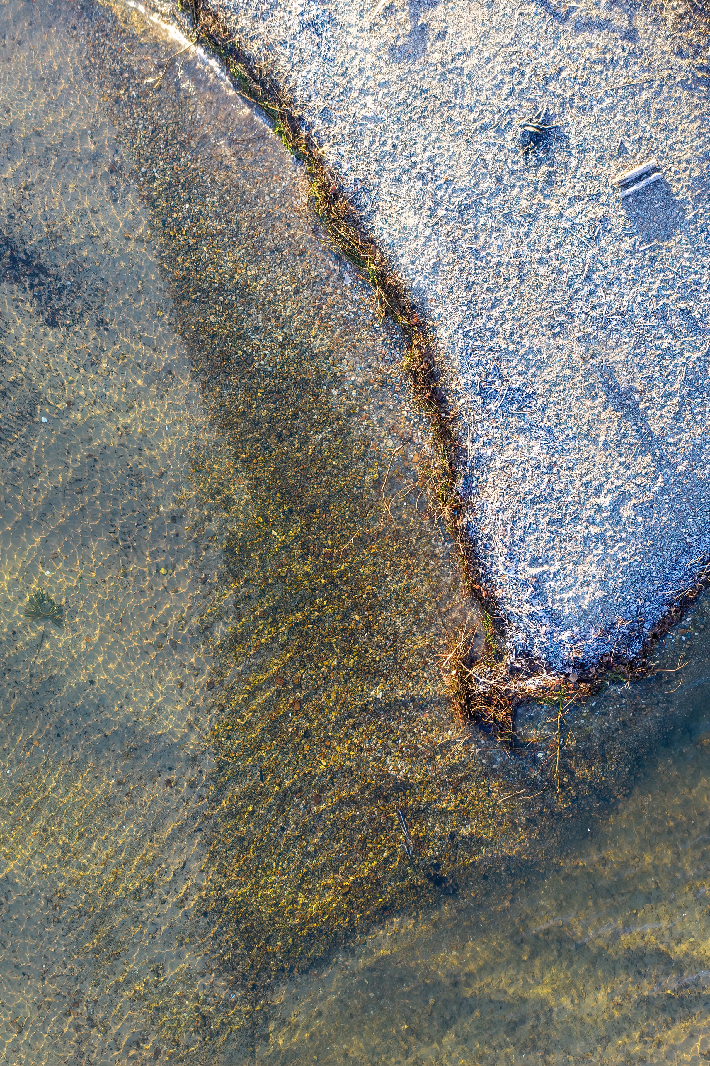 Abstract Aerial View of Rocky Shoreline and Water · Free Stock Photo