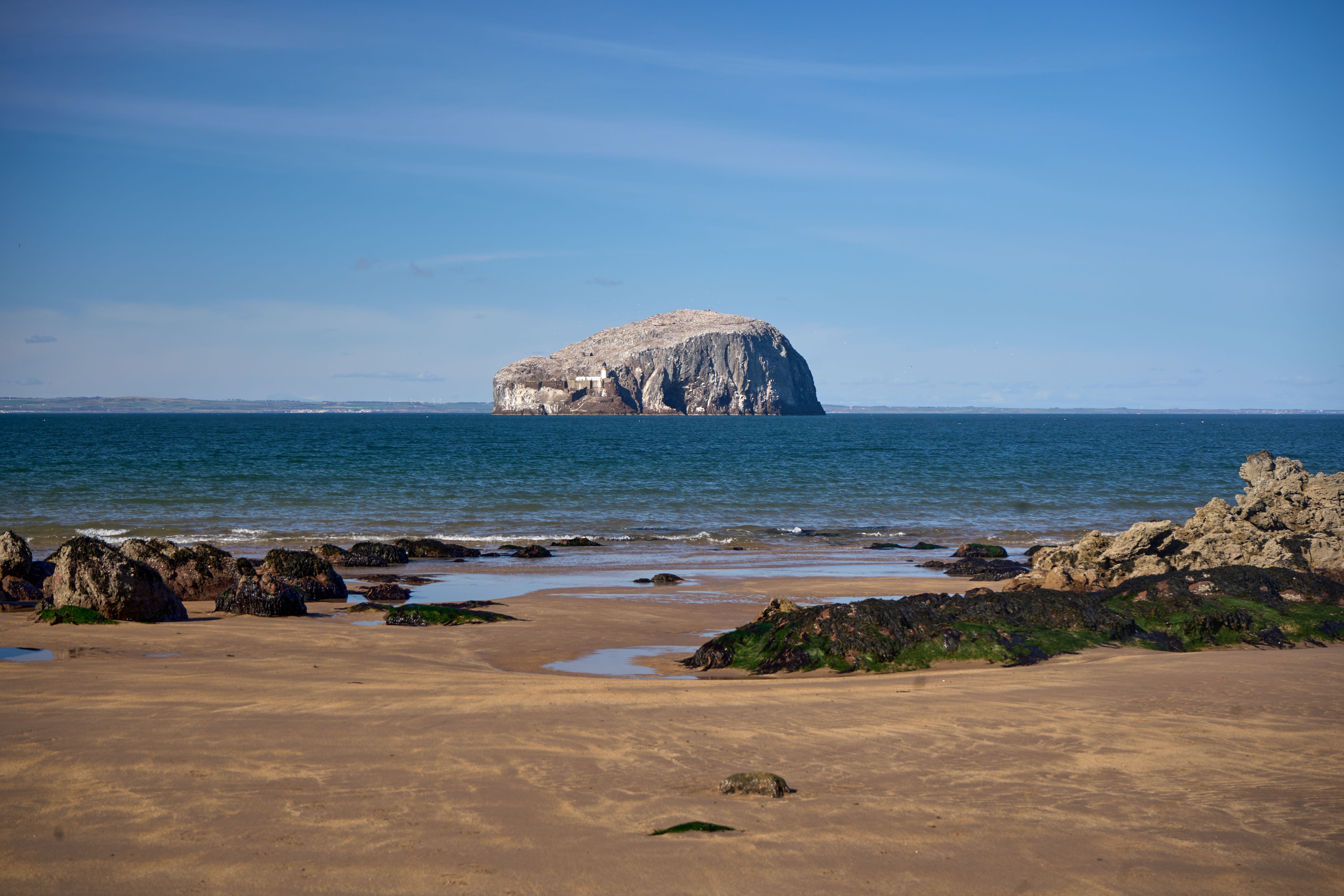 Beautiful view of Bass Rock from Seacliff Beach, Scotland, showcasing the serene coastal landscape.