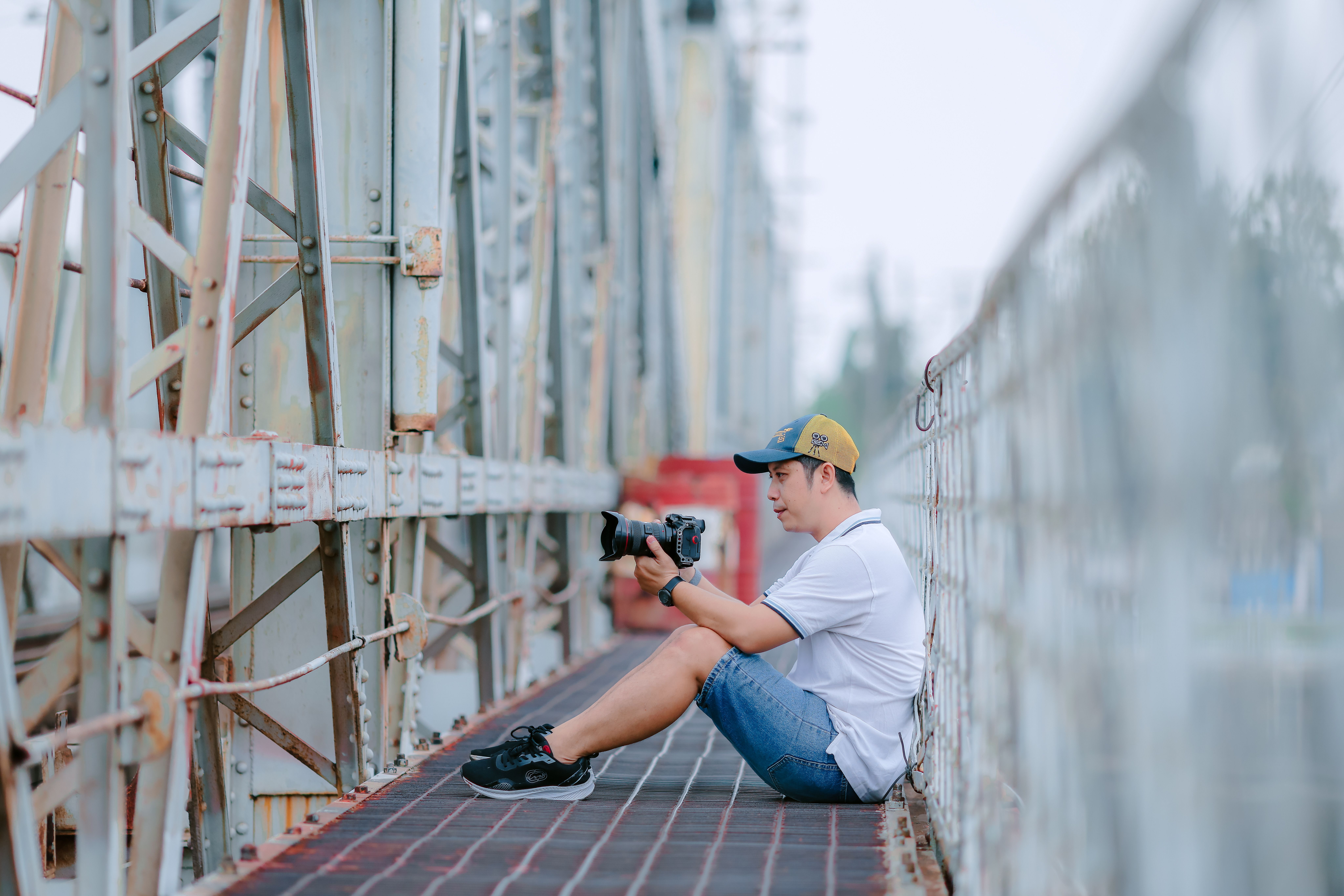 Man Photography Enthusiast on Urban Bridge · Free Stock Photo