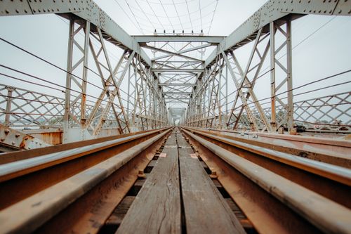 Free Dynamic view of an empty steel railway bridge showcasing industrial architecture. Stock Photo