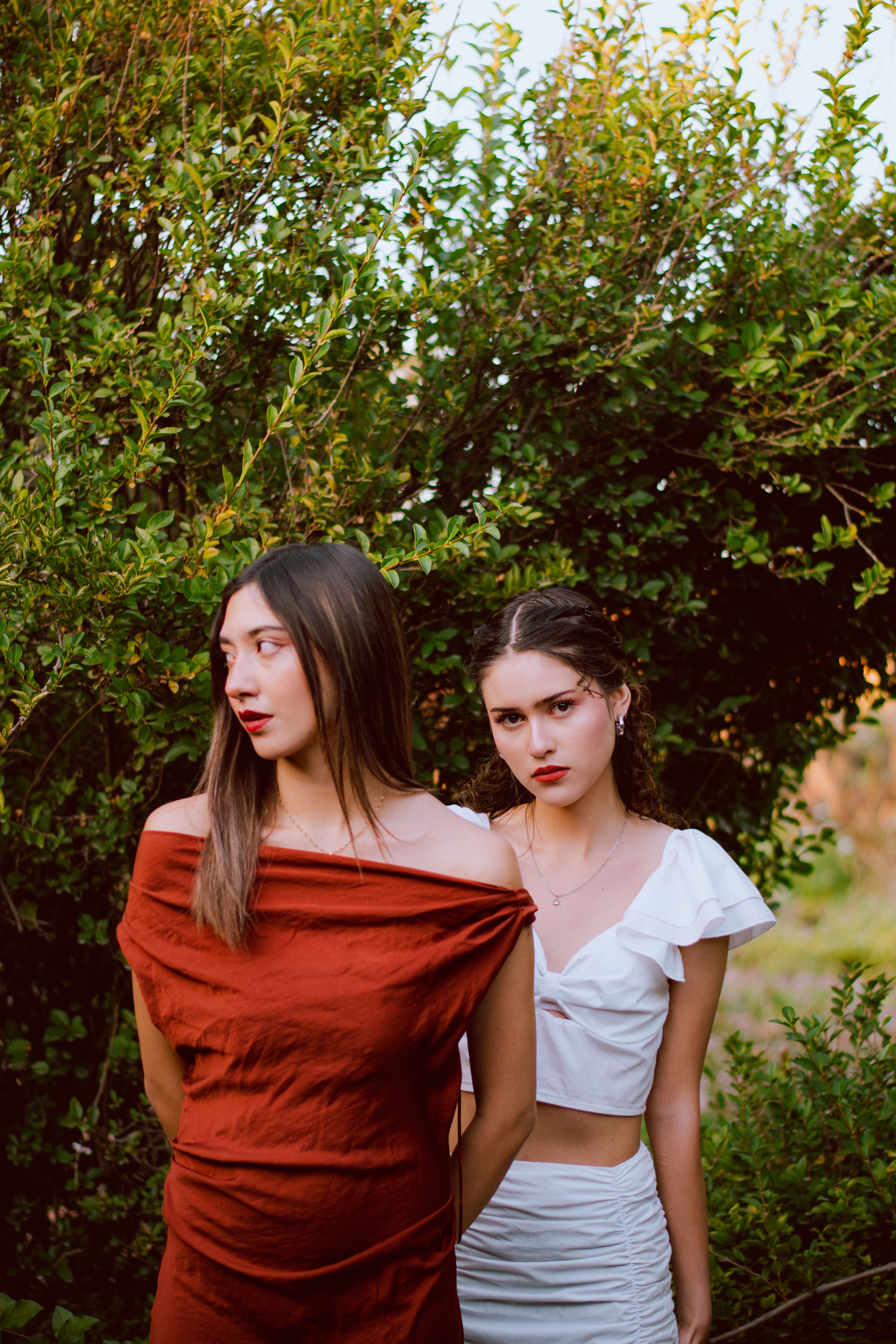Two Women in Stylish Dresses Outdoors · Free Stock Photo