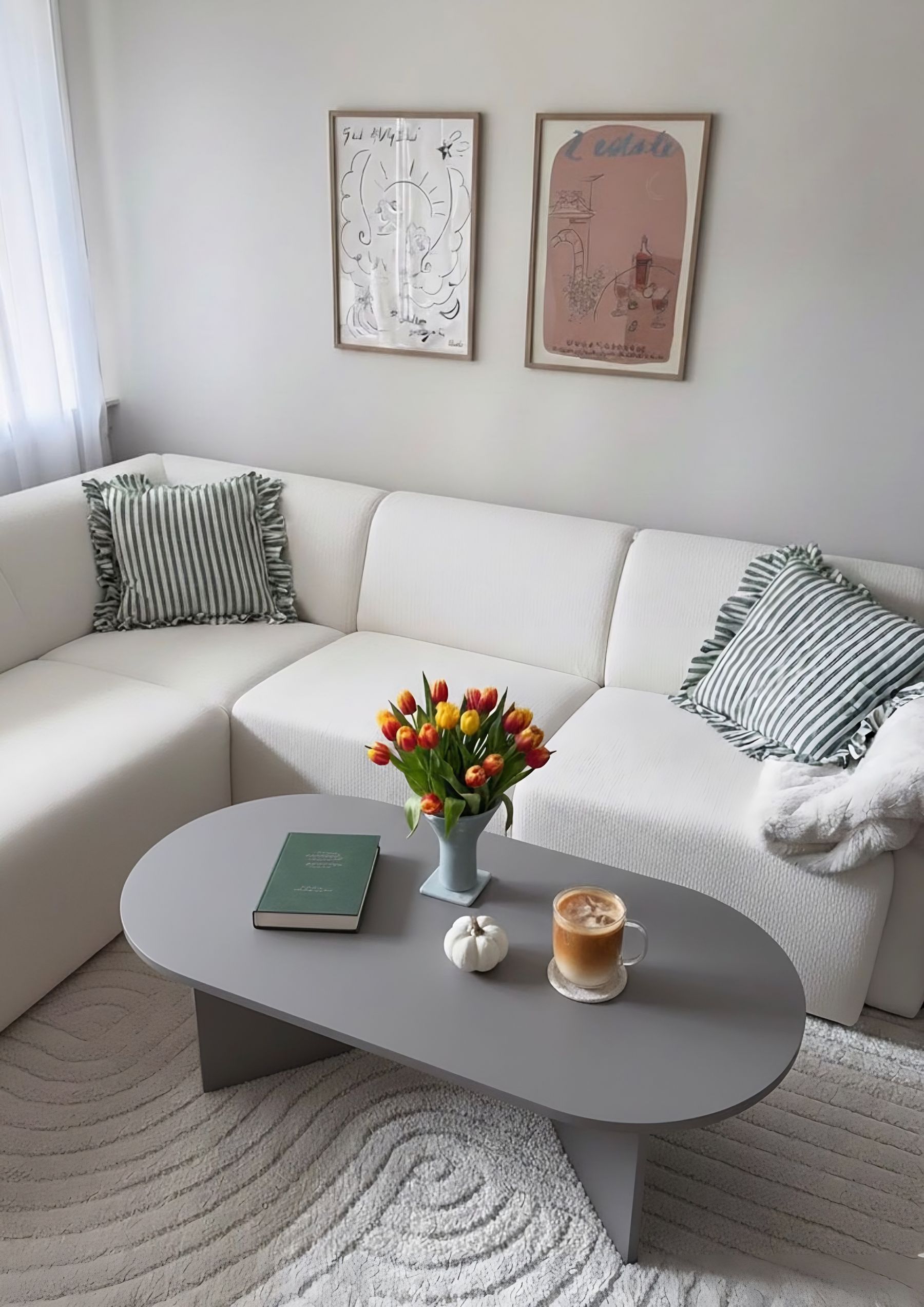 Soft neutral living room with tulips, pale textiles and restrained pastel accents