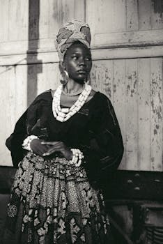 A captivating portrait capturing the elegance of traditional Nigerian attire in monochrome.
