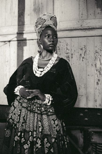 A captivating portrait capturing the elegance of traditional Nigerian attire in monochrome.