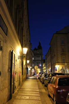Explore Prague's historic streets at night, beautifully illuminated and captivating.