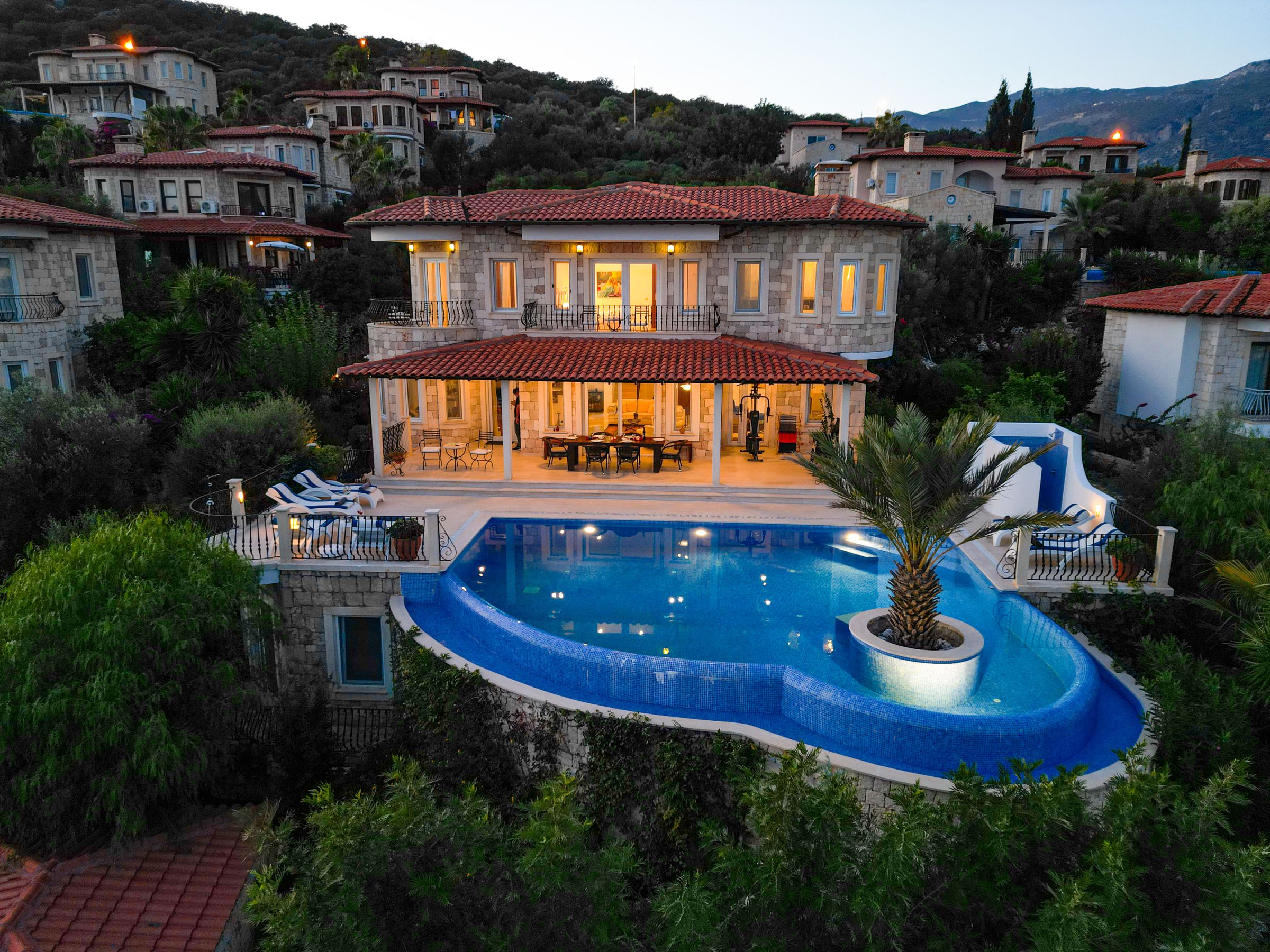 Bayside Coastal Estate — Exterior evening view