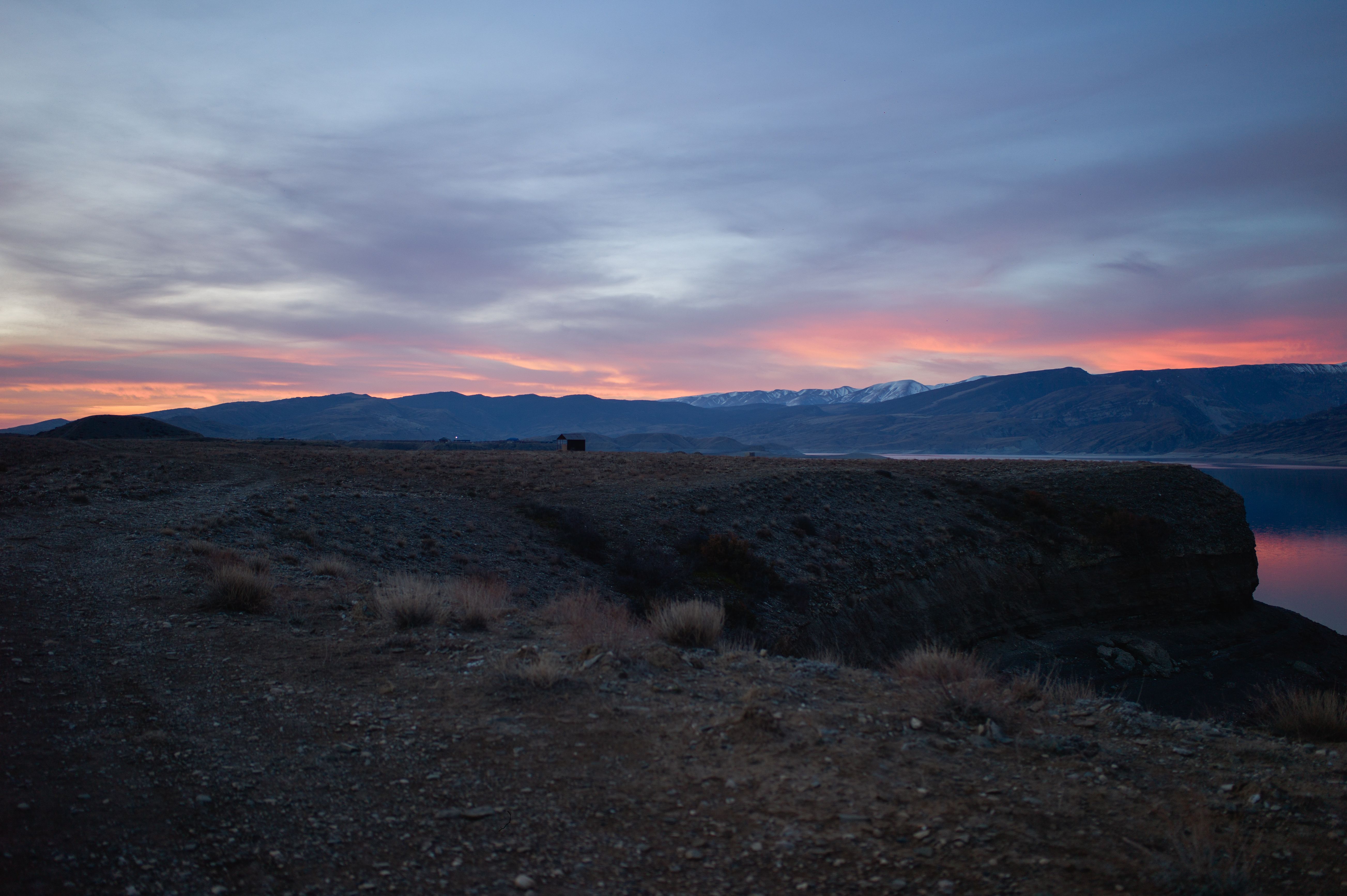 Stunning Sunset Over Serene Mountain Landscape · Free Stock Photo