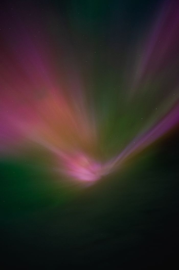 Aurora over a ridge by Daniil Ustinov on Pexels