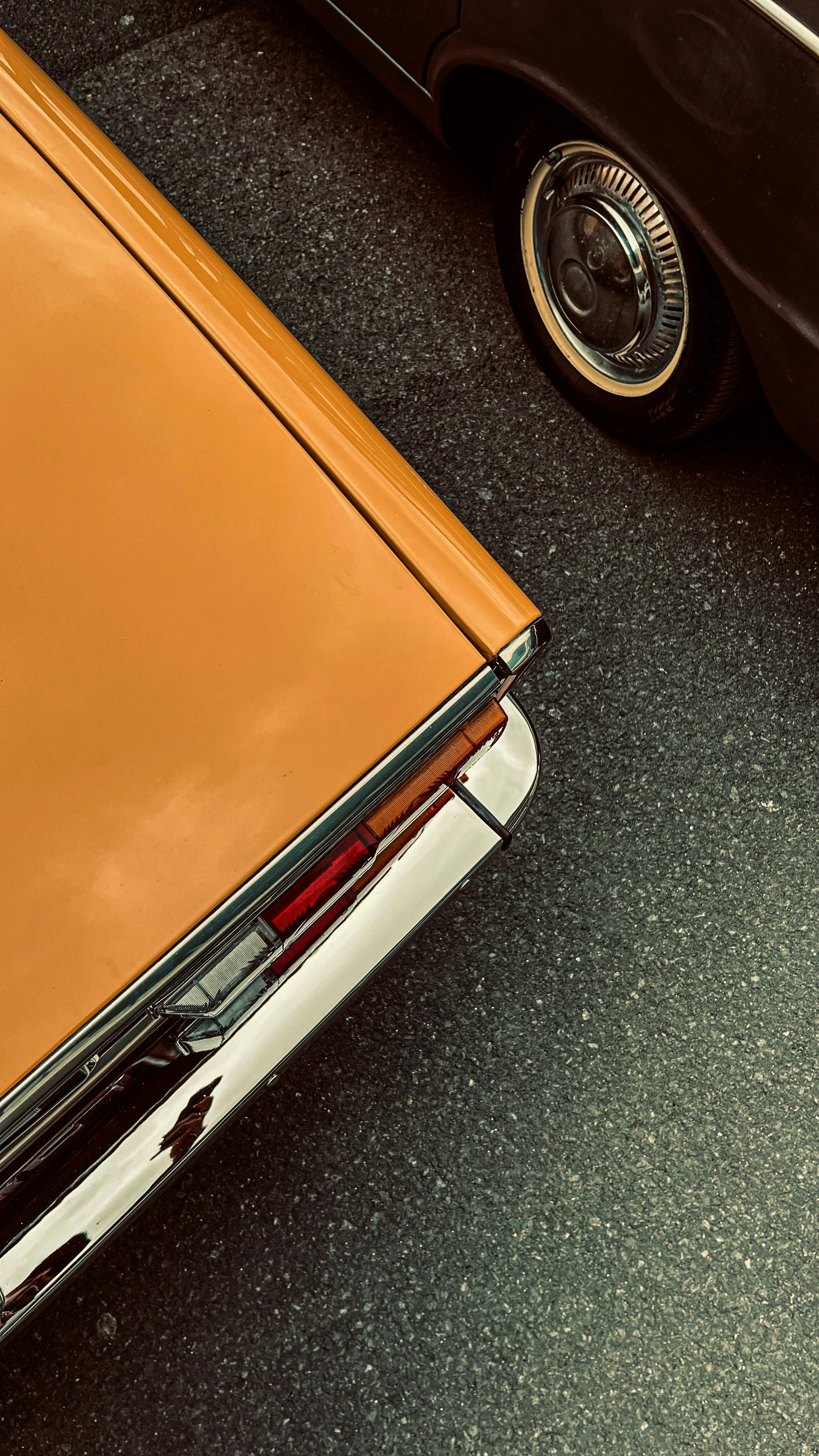 A close-up of a vintage car with a classic aesthetic, emphasizing sleek design and nostalgia.