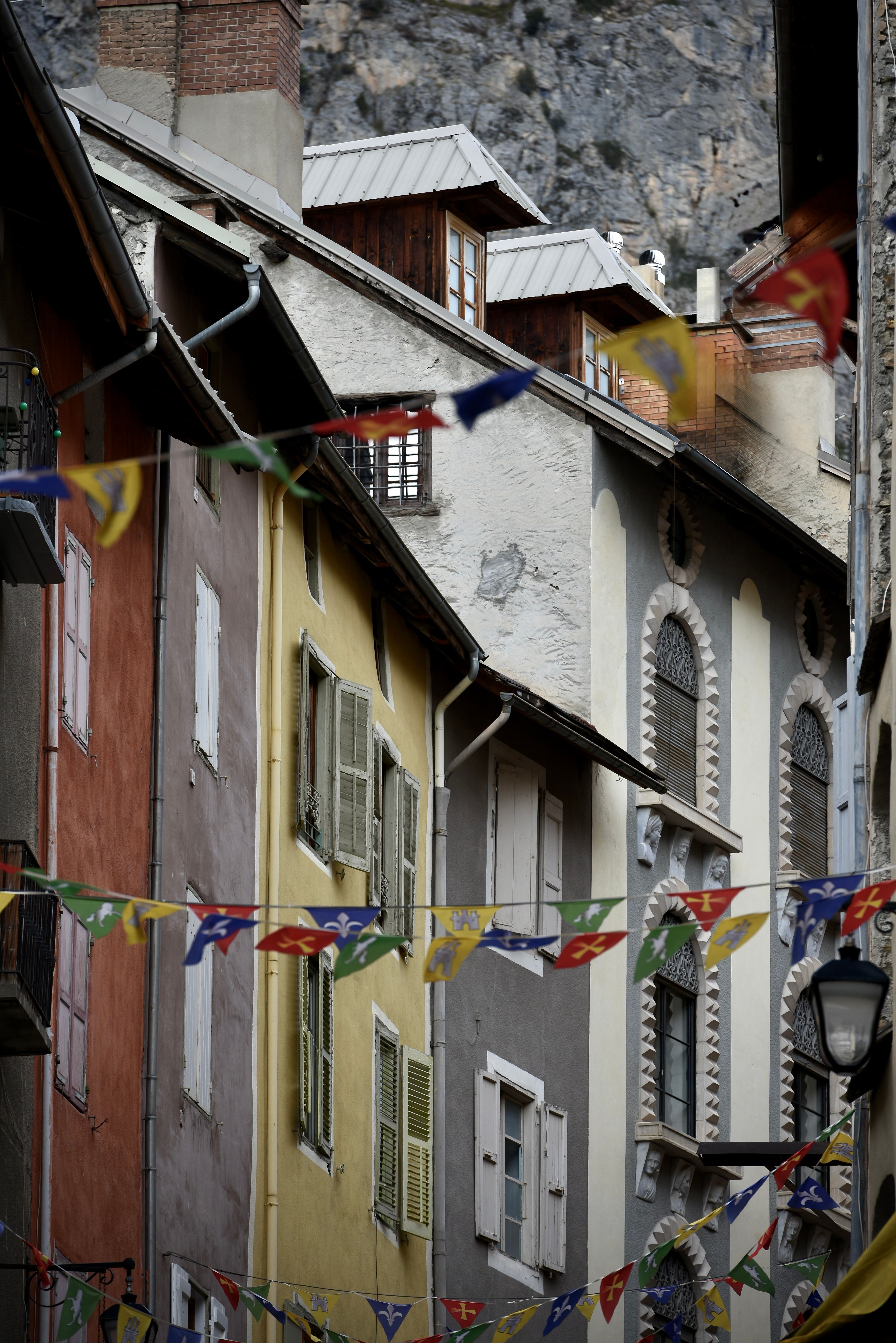 Colorful European Alley with Festive Bunting · Free Stock Photo