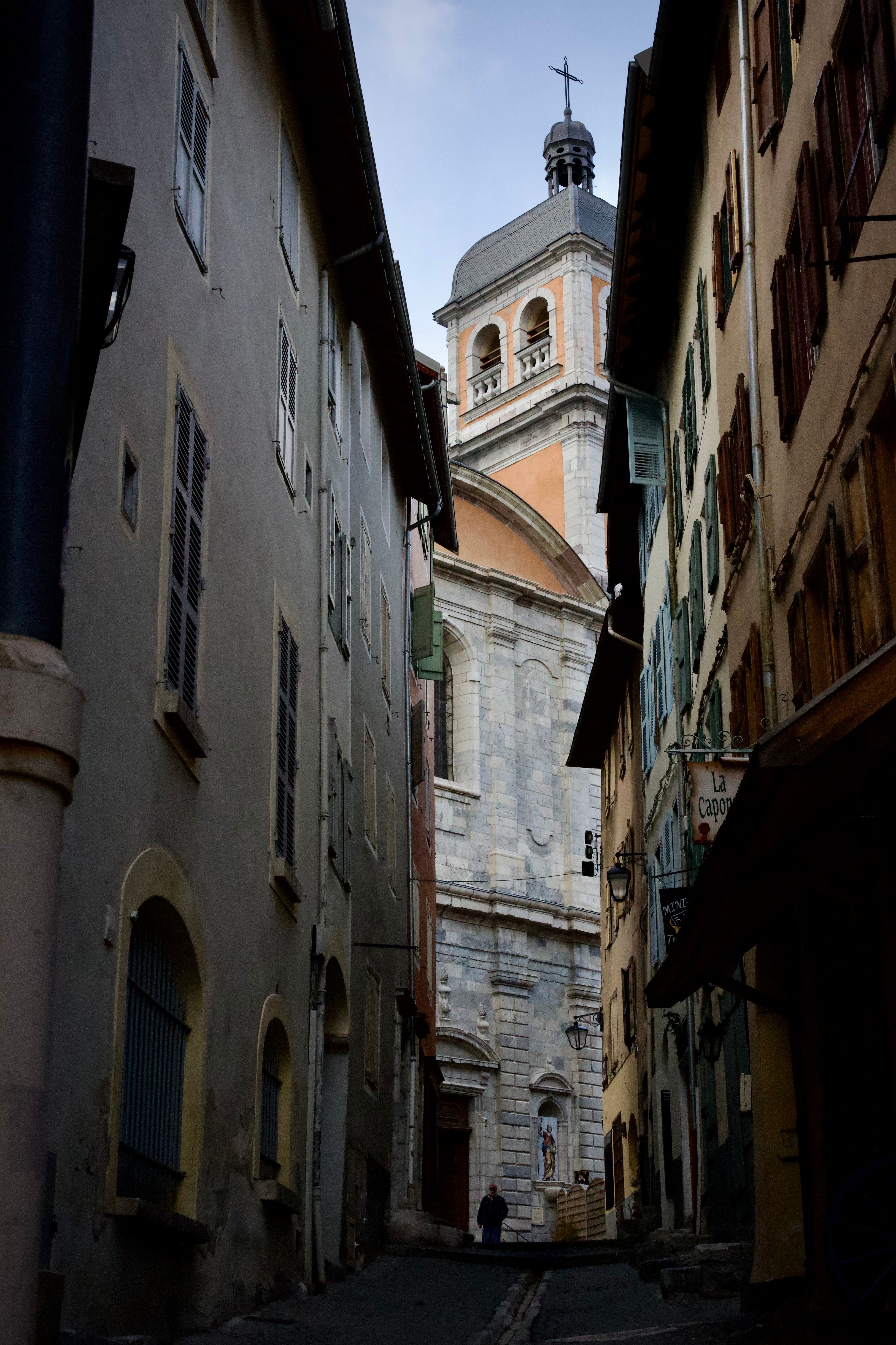 Charming European Alley with Historic Church · Free Stock Photo