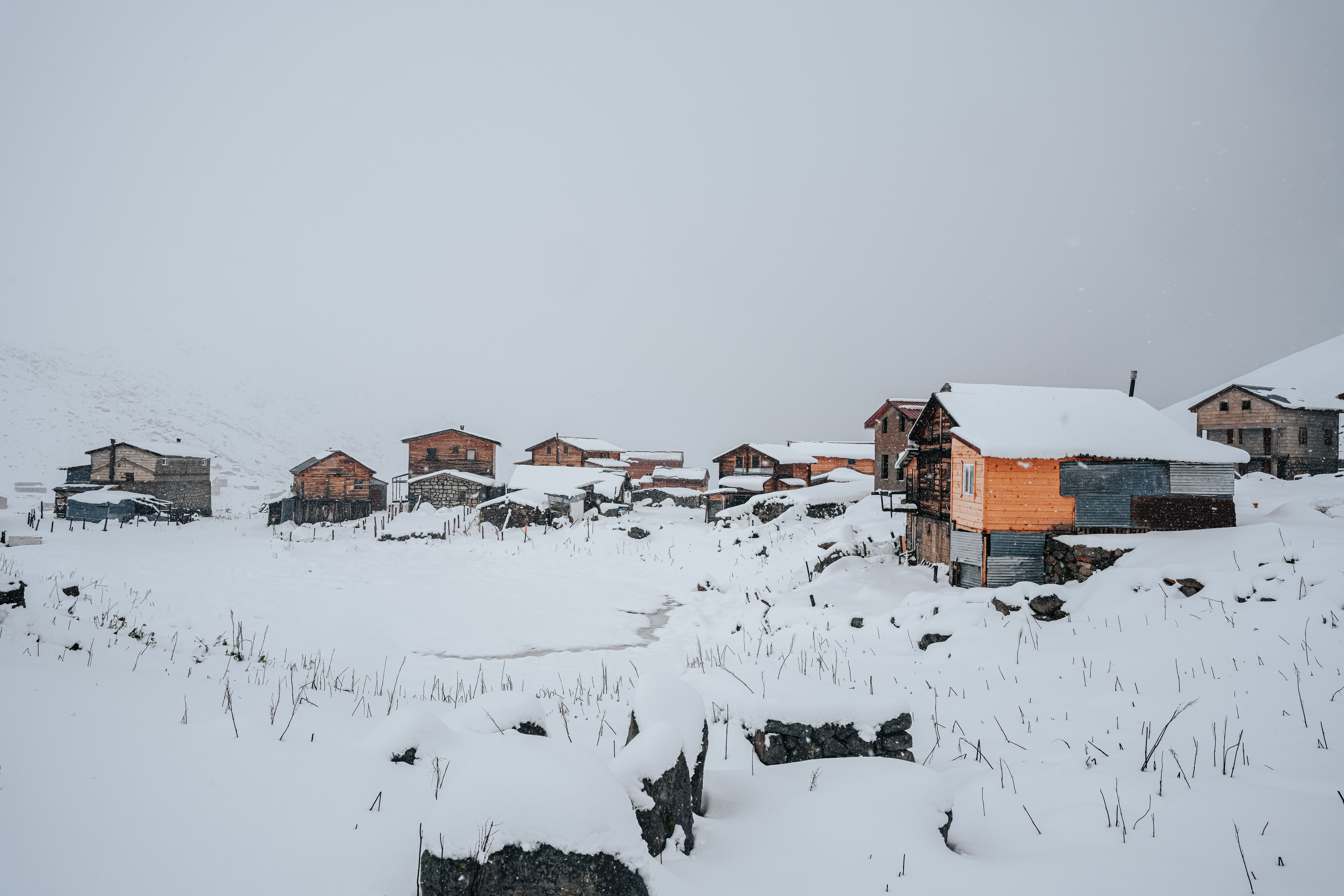 Remote Snow Covered Mountain Village Landscape · Free Stock Photo