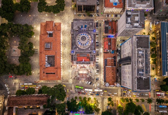 An aerial view of Cinelândia Square and vibrant architecture at night in Rio de Janeiro, Brazil.