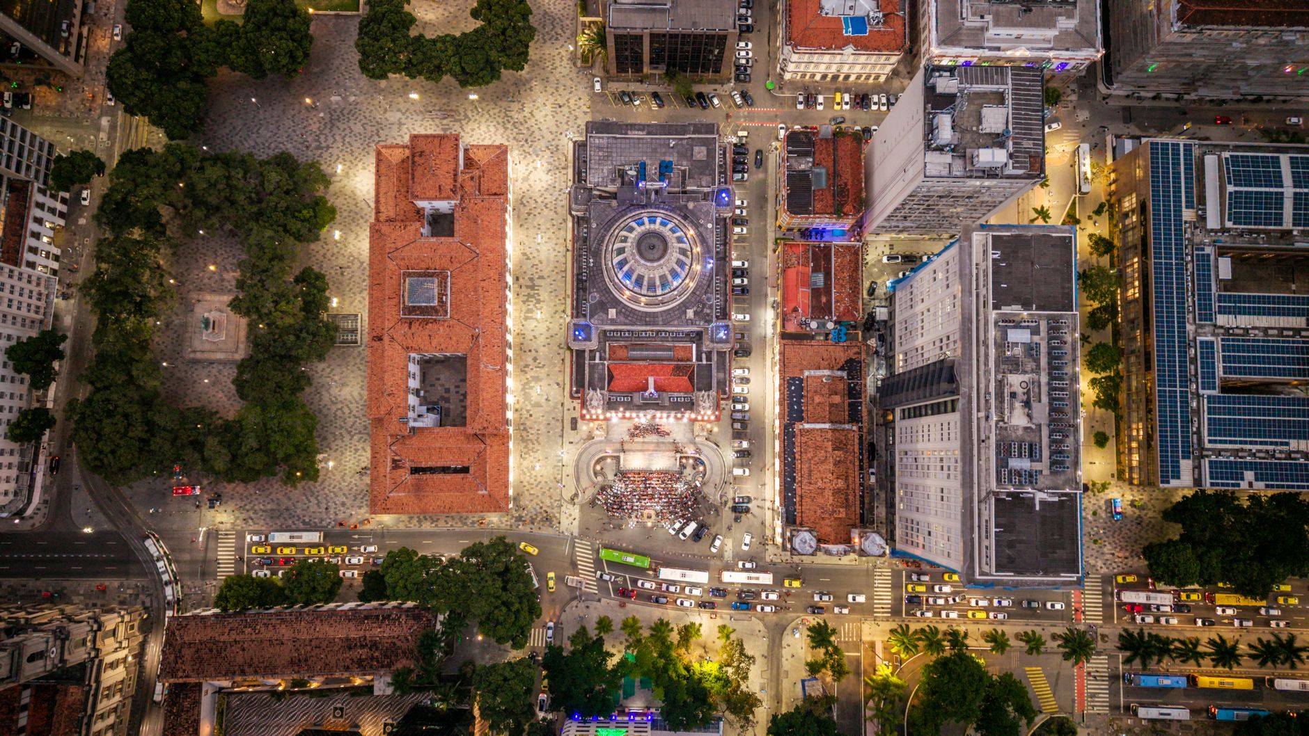 An aerial view of Cinelândia Square and vibrant architecture at night in Rio de Janeiro, Brazil.