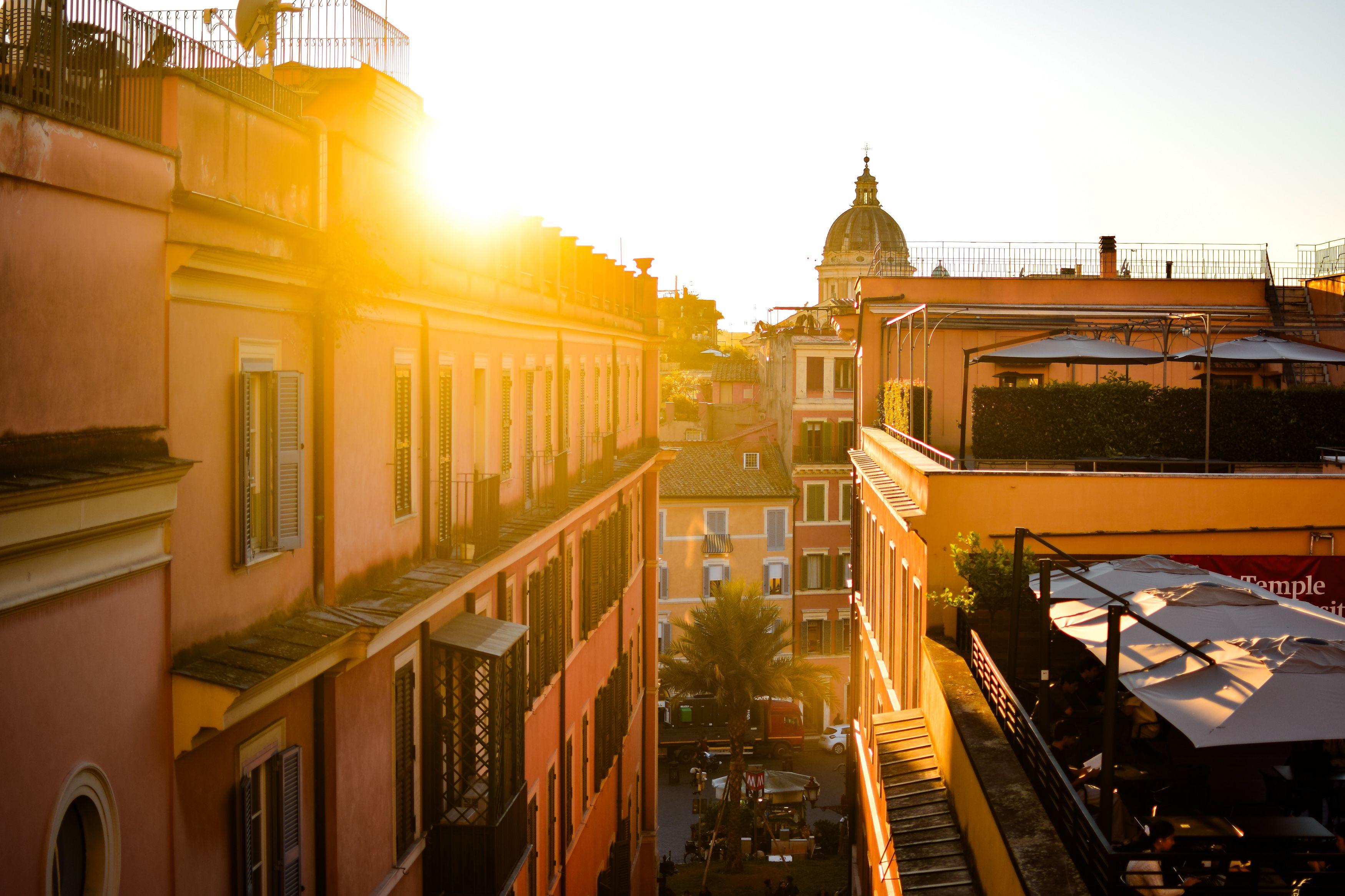 Rooftop terrace at a mid-range Prati hotel with a view of St. Peter's dome, Rome