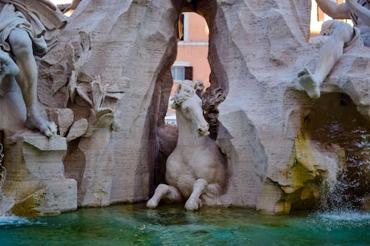 Elegant marble horse sculpture within a famous Roman fountain, showcasing classic art.