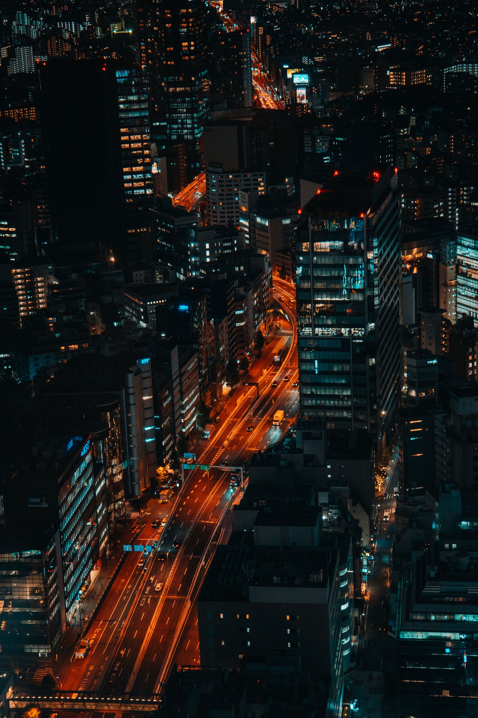Tokyo neon streets at night, aerial