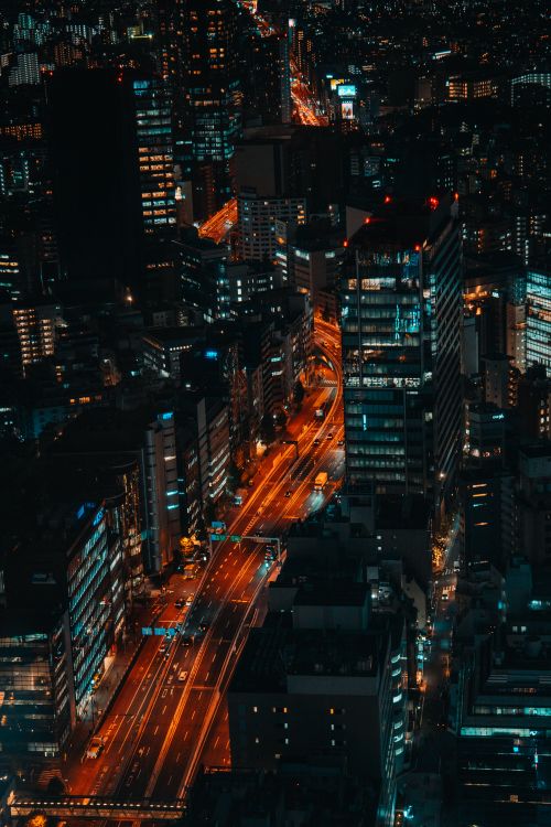 Free Vibrant aerial shot of Shibuya's illuminated skyline at night, showcasing bustling city life. Stock Photo