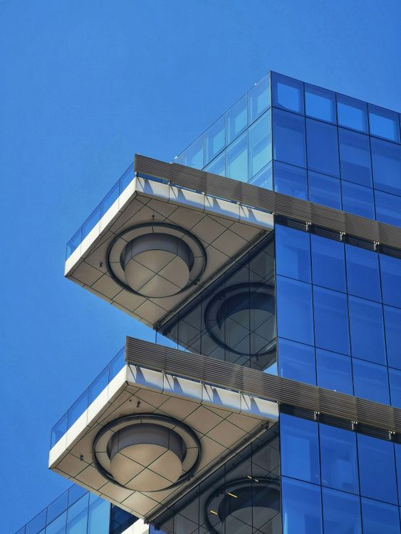 Glass Building Geometry Modern Glass Building with Geometric Architecture · Free Stock Photo