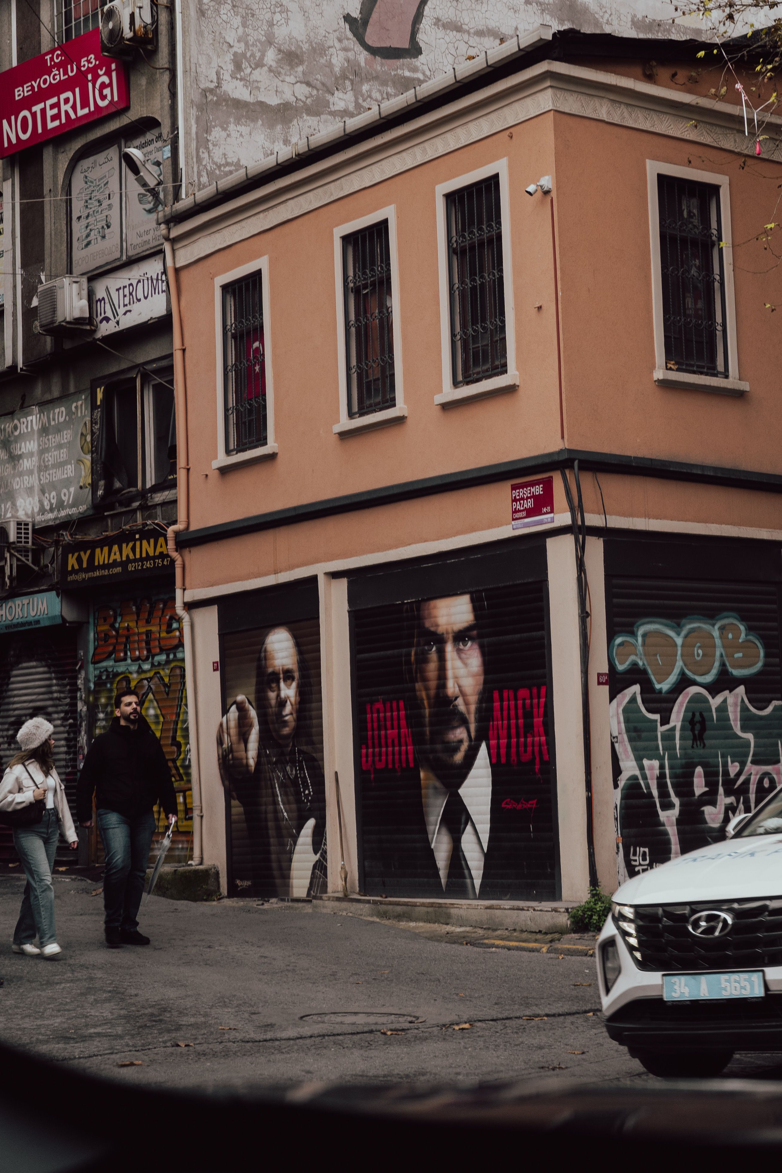 Colorful street art and urban graffiti on a corner building in Beyoğlu, İstanbul.