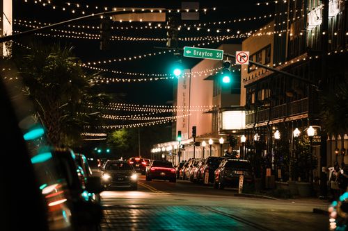 Free Night scene with cars and bright street lights on bustling Drayton Street in Savannah. Stock Photo