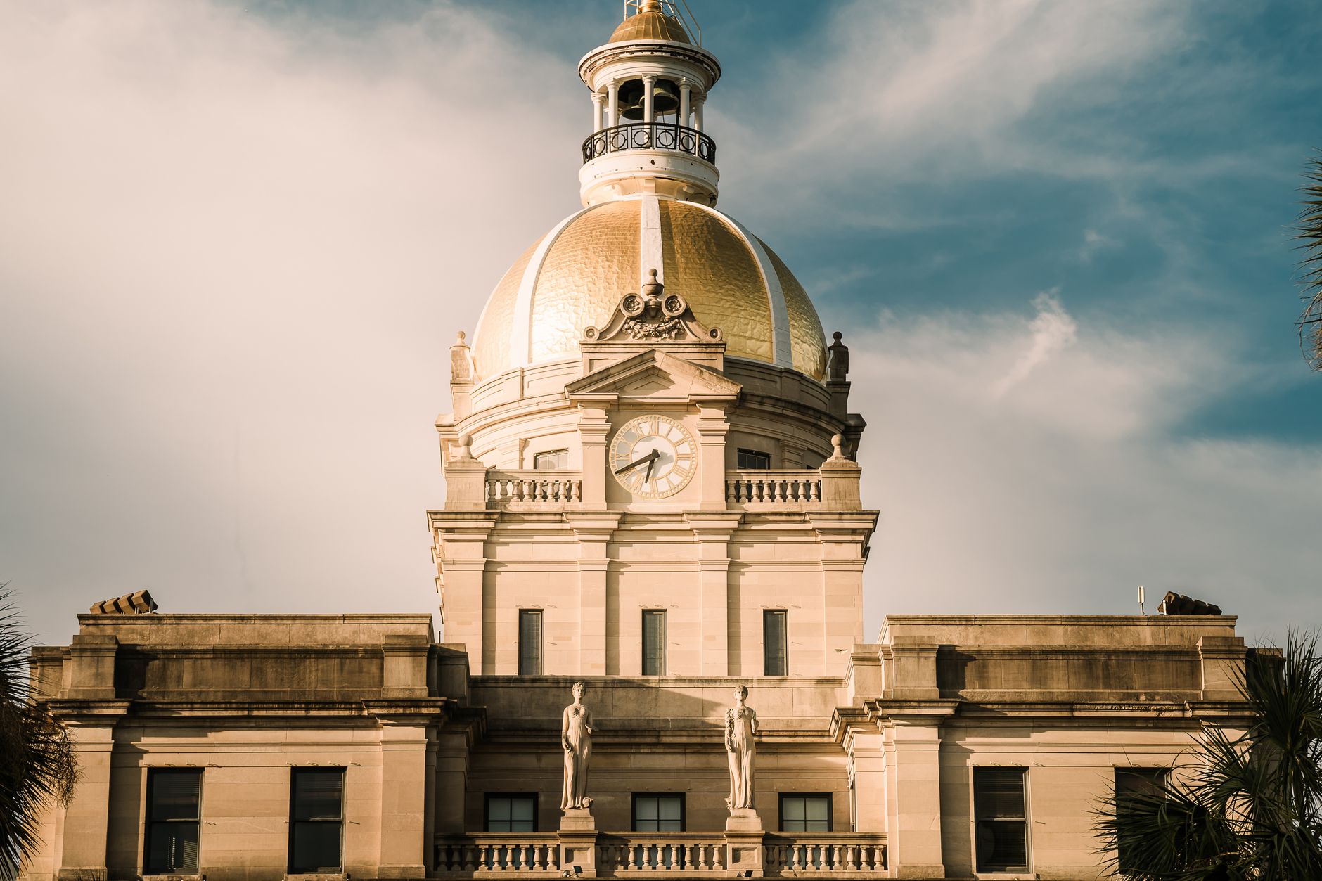 Elegant view of Savannah City Hall's golden dome and architectural details in Georgia, USA.