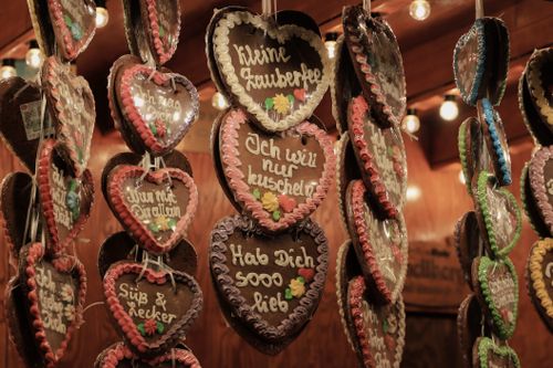 Free Festive gingerbread hearts on display at a Christmas market in Kassel, Germany, capturing the holiday spirit. Stock Photo