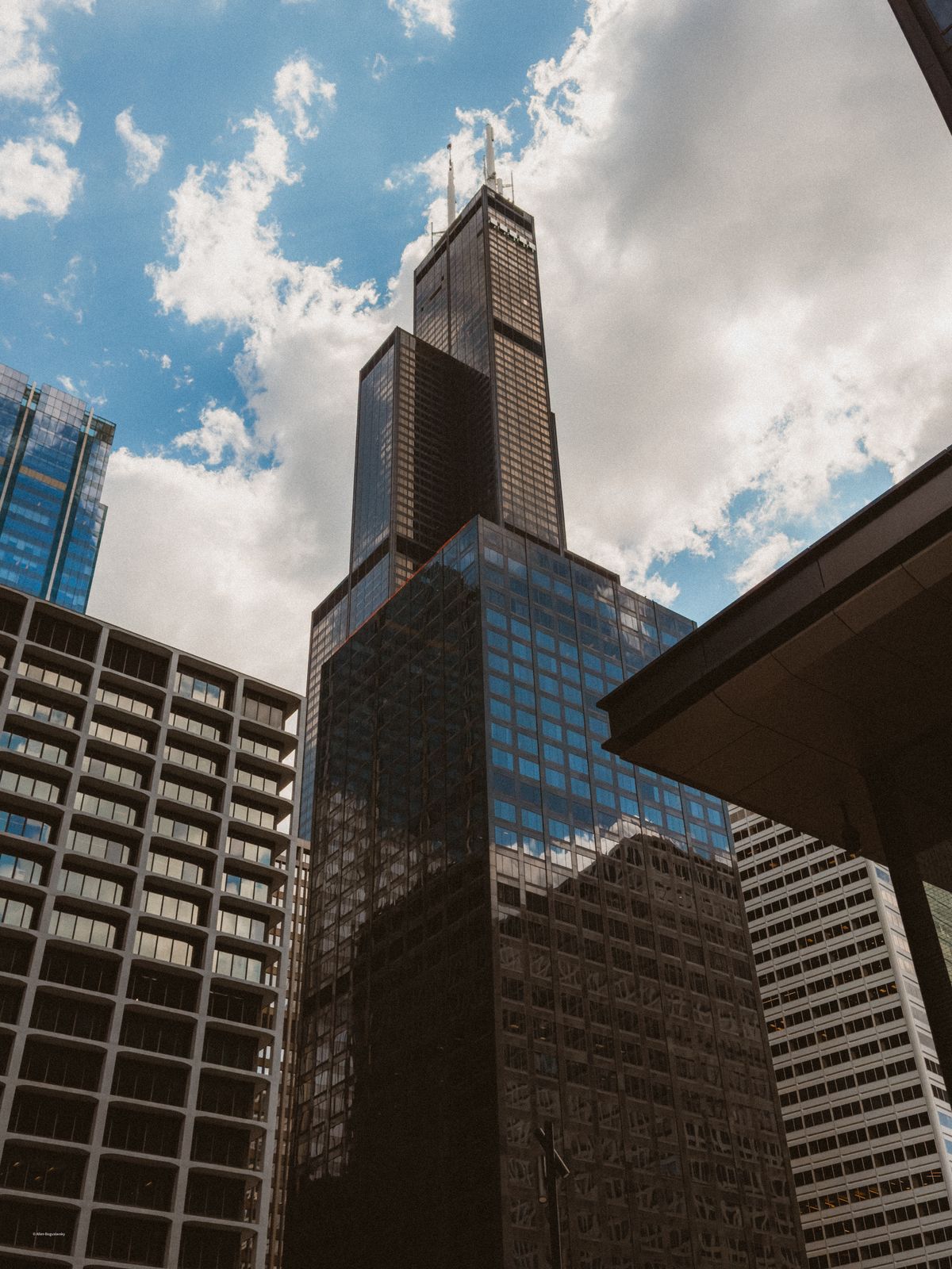 Skyscraper and Building behind Window · Free Stock Photo