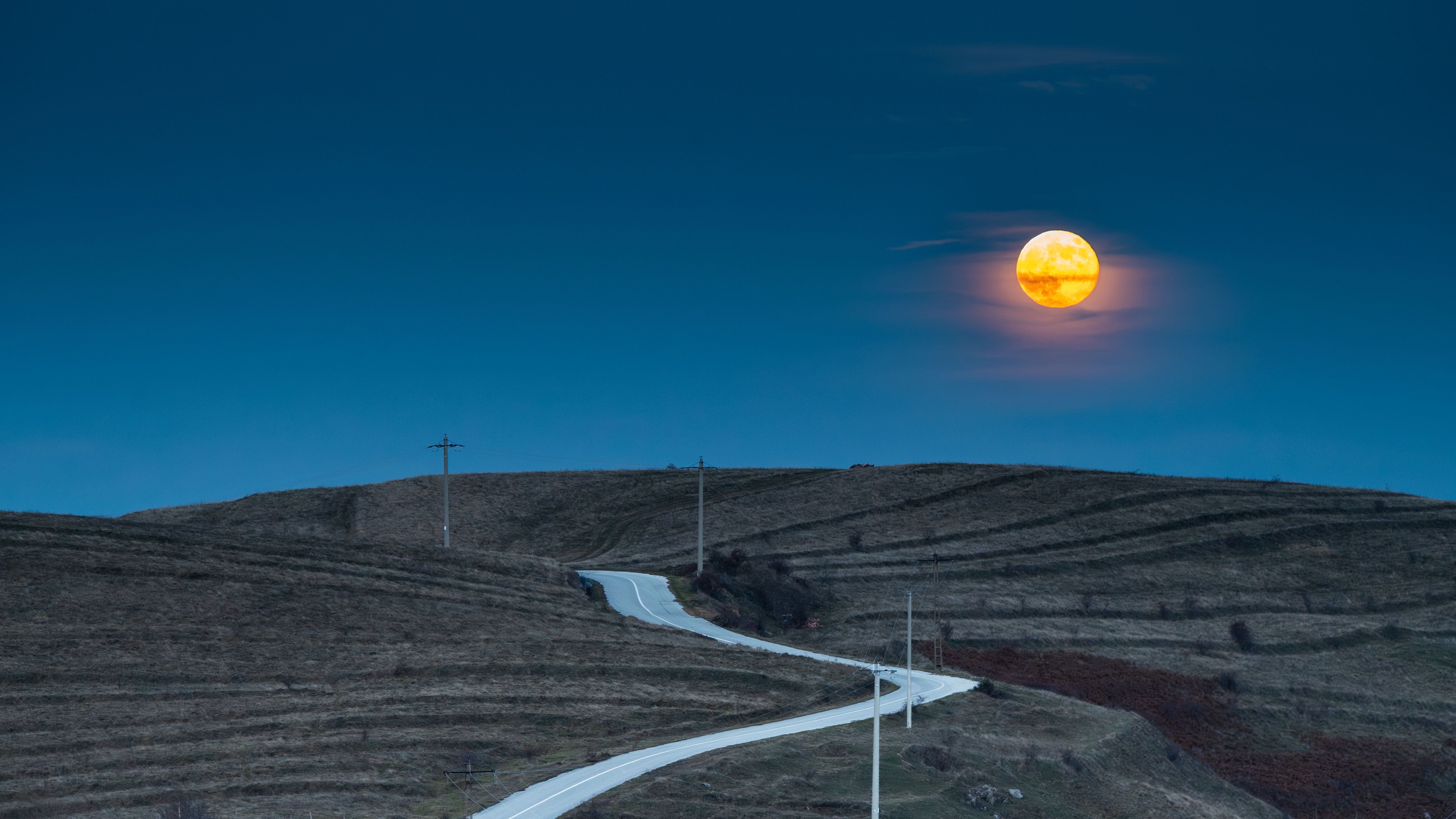 Serene Moonrise Over Winding Rural Road · Free Stock Photo