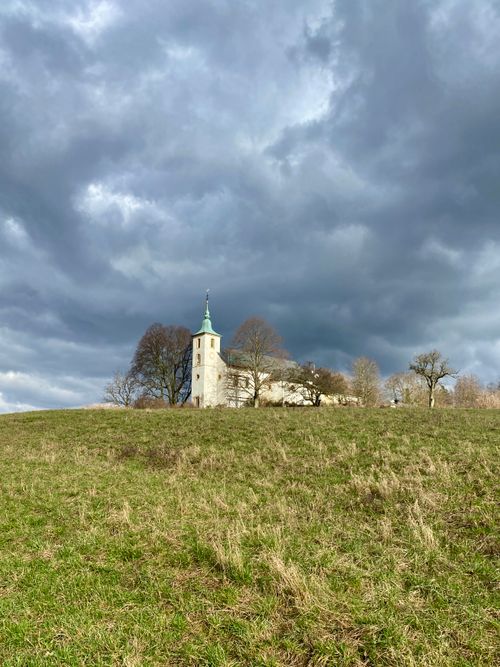 Free A picturesque church under a moody sky in Forst, Germany, capturing the essence of dramatic architecture. Stock Photo