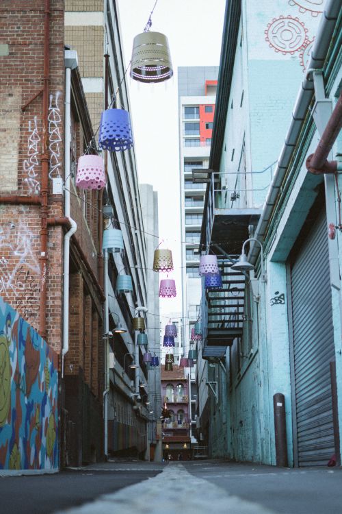 Free A vibrant alley in Perth with hanging lamps and graffiti art, showcasing urban creativity. Stock Photo