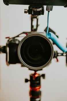 Detailed view of a professional camera setup on a tripod, perfect for videography or photography themes.