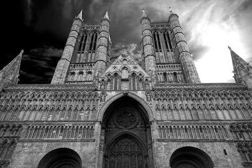Free Grayscale Low Angle View of Cathedral Stock Photo