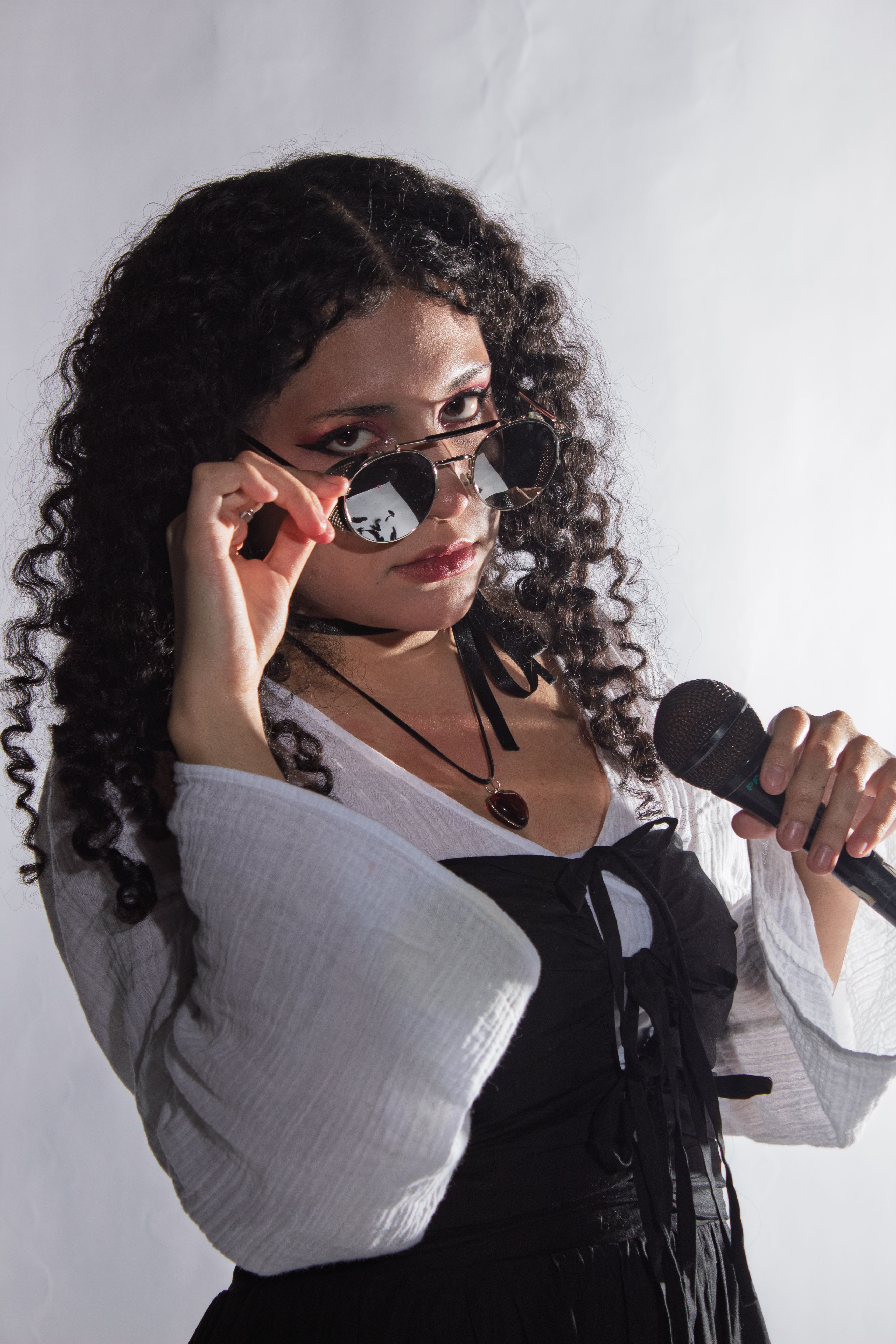 Stylish Portrait of Woman with Microphone · Free Stock Photo