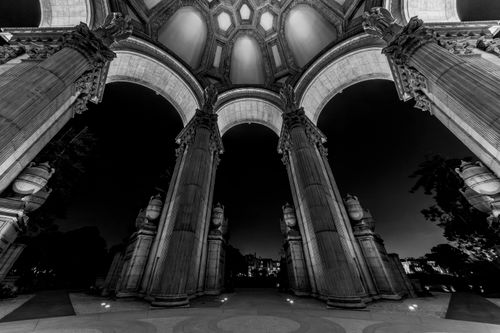 Free Black and white architecture shot of Palace of Fine Arts at night with iconic columns. Stock Photo