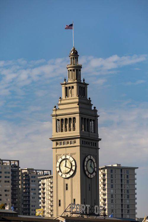 Free The historic Ferry Building clock tower in San Francisco stands out against a clear blue sky. Stock Photo