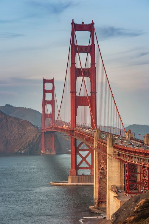 Free Stunning view of the Golden Gate Bridge glistening at sunset in San Francisco. Stock Photo